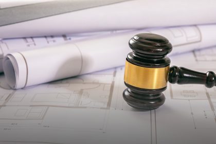 Labor,And,Construction,Law,Concept.,Judge,Gavel,On,Building,Blueprint